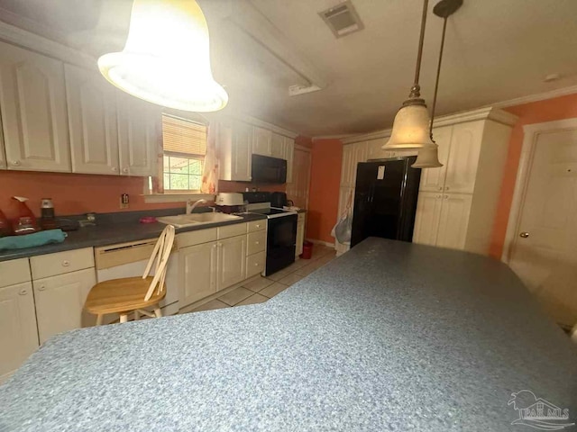 kitchen featuring black appliances, a sink, dark countertops, light tile patterned flooring, and ornamental molding