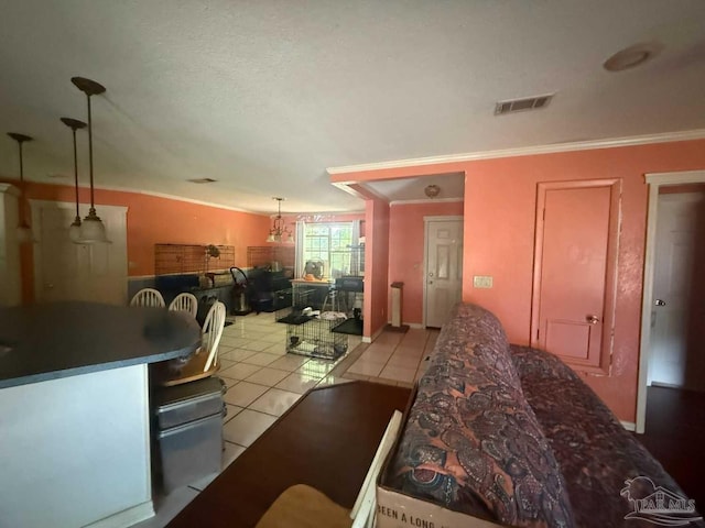 dining room with light tile patterned flooring and ornamental molding