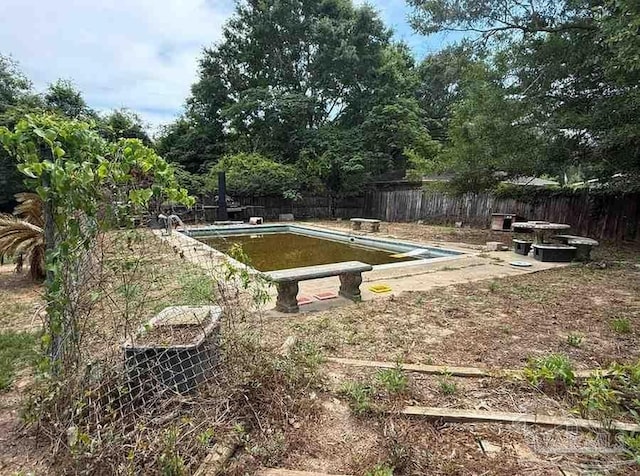 view of pool with fence