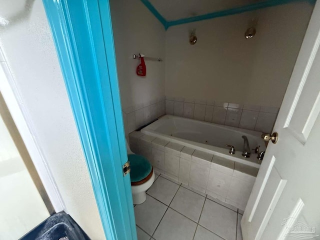 full bath featuring tile patterned floors, a bath, and toilet