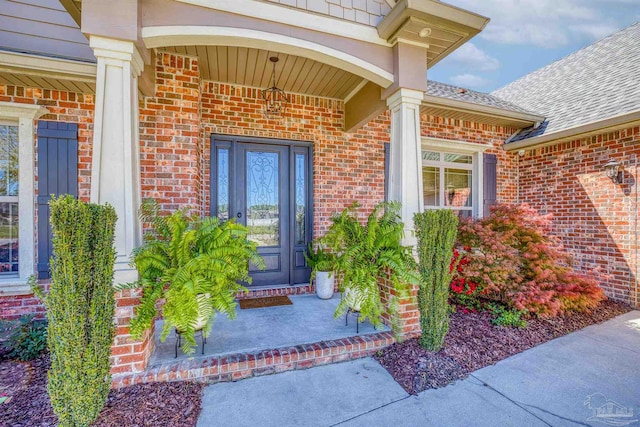 property entrance featuring a porch