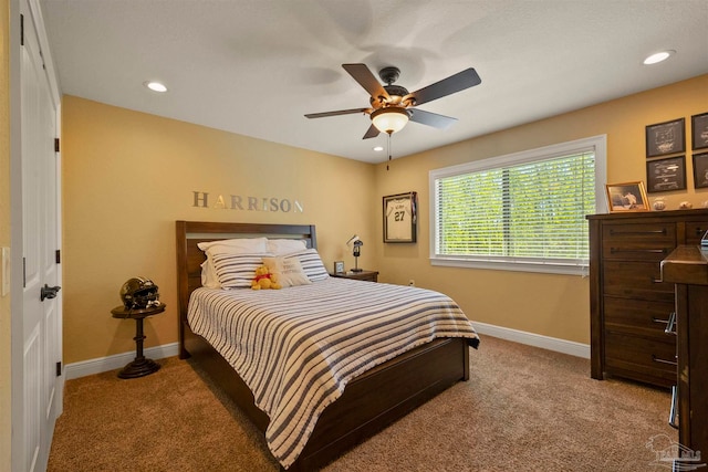 bedroom with light carpet and ceiling fan