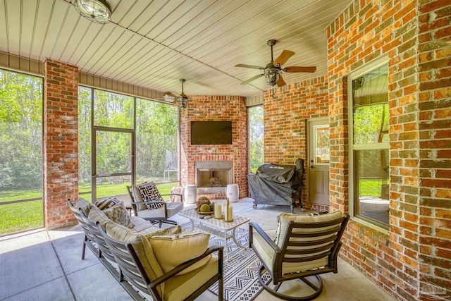 sunroom with wood ceiling and ceiling fan