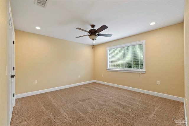 empty room featuring ceiling fan and carpet floors