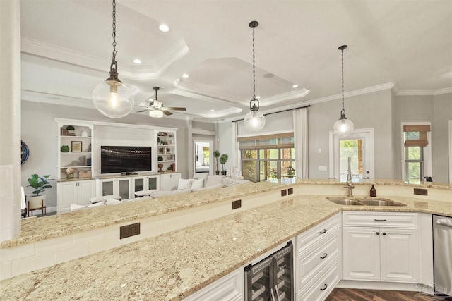 living room with light carpet, crown molding, coffered ceiling, and ceiling fan