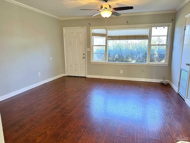 unfurnished room with crown molding, baseboards, ceiling fan, and dark wood-style flooring