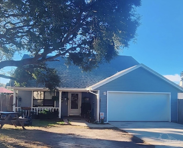 view of front of house with covered porch and a garage