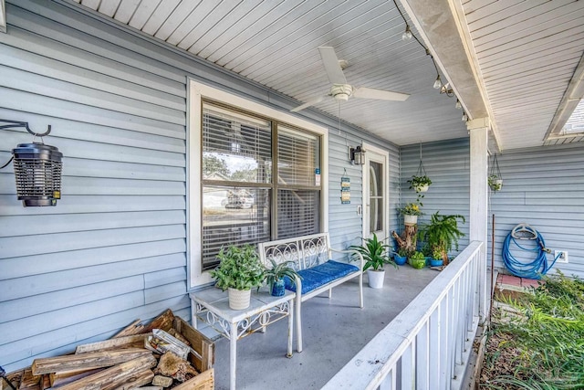 view of patio / terrace with ceiling fan and a porch