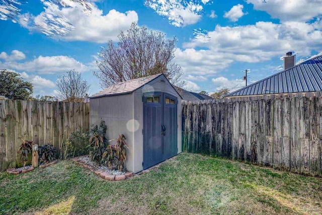 view of outbuilding with a lawn