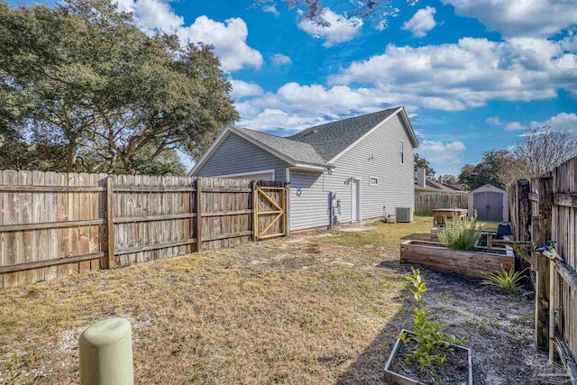 exterior space with a shed and central air condition unit