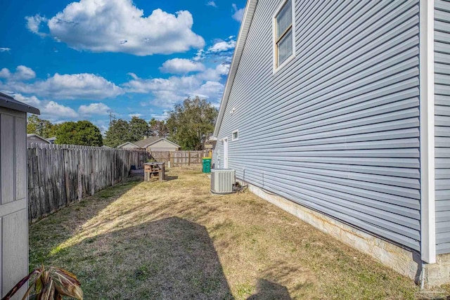 view of yard with central AC