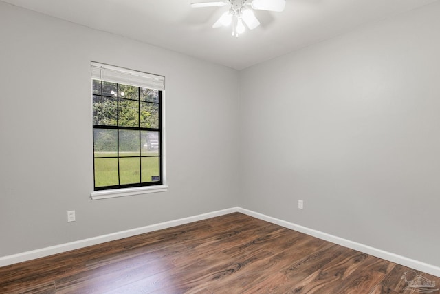 spare room with ceiling fan and dark hardwood / wood-style floors