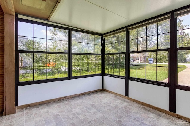 unfurnished sunroom featuring a healthy amount of sunlight