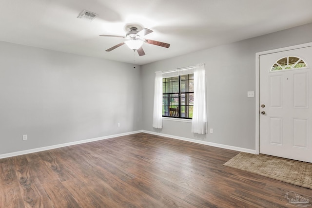 entrance foyer featuring ceiling fan and dark wood-type flooring