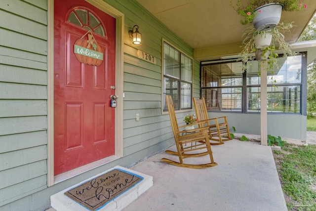 entrance to property with covered porch