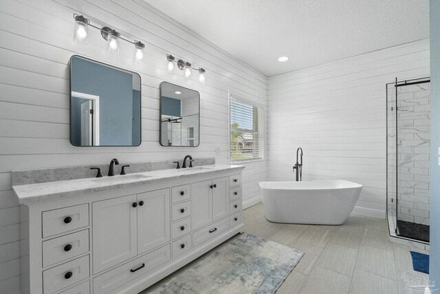 7008 Turnberry Cir, Navarre, FL 32566 - full bath featuring a tile shower, double vanity, a sink, and a freestanding tub