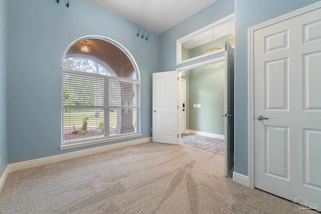 7008 Turnberry Cir, Navarre, FL 32566 - spare room with baseboards and carpet flooring