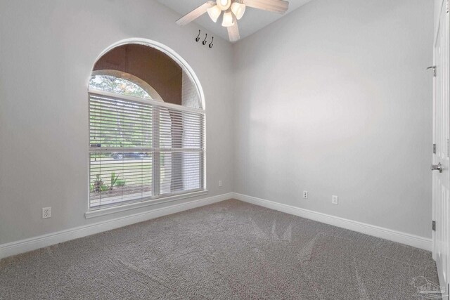 7008 Turnberry Cir, Navarre, FL 32566 - carpeted spare room featuring ceiling fan and baseboards