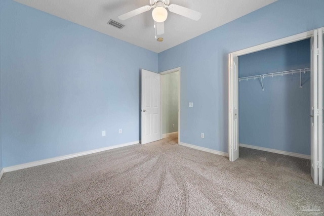 7008 Turnberry Cir, Navarre, FL 32566 - unfurnished bedroom featuring visible vents, ceiling fan, carpet flooring, and a closet