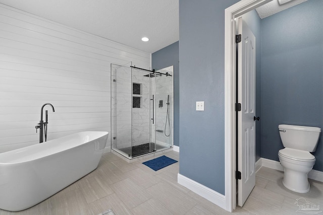 7008 Turnberry Cir, Navarre, FL 32566 - full bath featuring baseboards, tile patterned floors, toilet, a soaking tub, and a stall shower