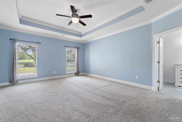 7008 Turnberry Cir, Navarre, FL 32566 - spare room featuring ornamental molding, ceiling fan, carpet floors, and a tray ceiling