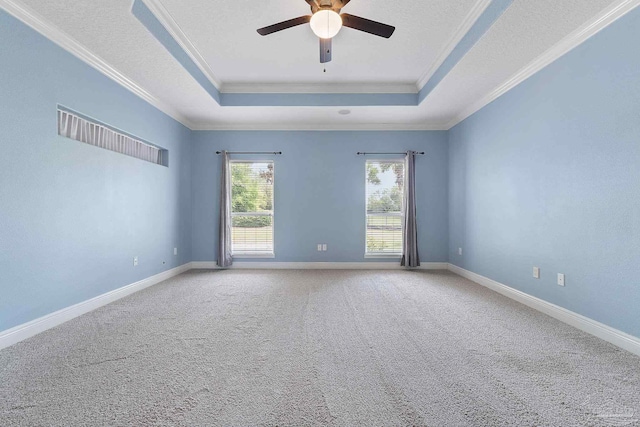7008 Turnberry Cir, Navarre, FL 32566 - carpeted spare room featuring baseboards, a raised ceiling, a ceiling fan, and crown molding