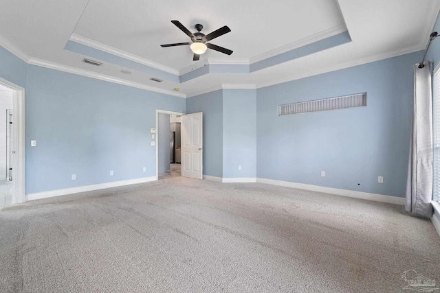 7008 Turnberry Cir, Navarre, FL 32566 - unfurnished bedroom featuring visible vents, carpet, ornamental molding, and a tray ceiling