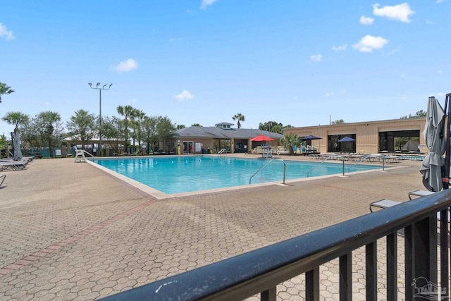 7008 Turnberry Cir, Navarre, FL 32566 - community pool with a patio