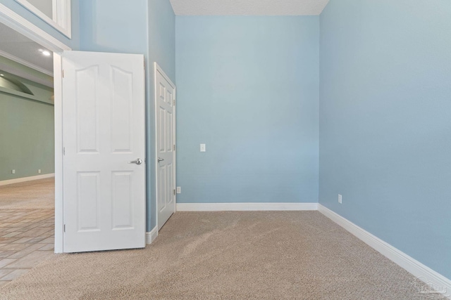 7008 Turnberry Cir, Navarre, FL 32566 - unfurnished bedroom with light carpet and baseboards