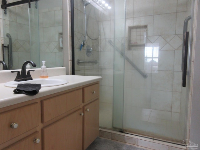 bathroom with vanity and walk in shower