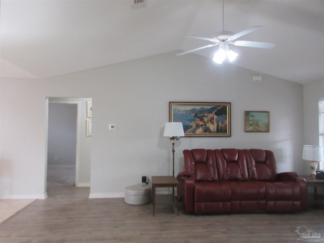 living room featuring light wood-type flooring, ceiling fan, and lofted ceiling