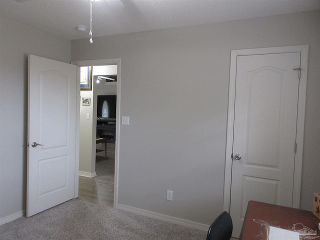 bedroom featuring ceiling fan and light colored carpet