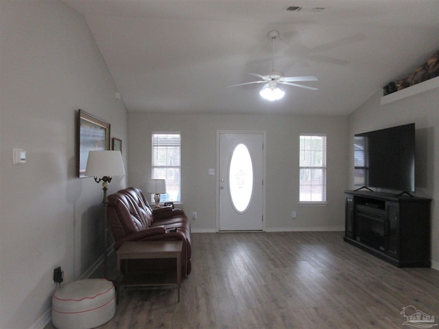 entrance foyer with ceiling fan, dark hardwood / wood-style flooring, a healthy amount of sunlight, and vaulted ceiling