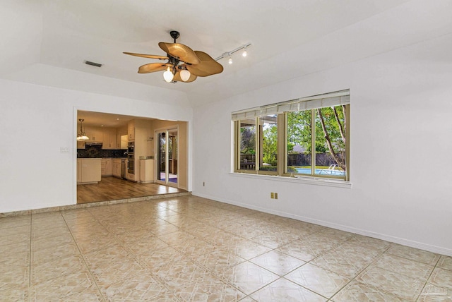 unfurnished room featuring ceiling fan