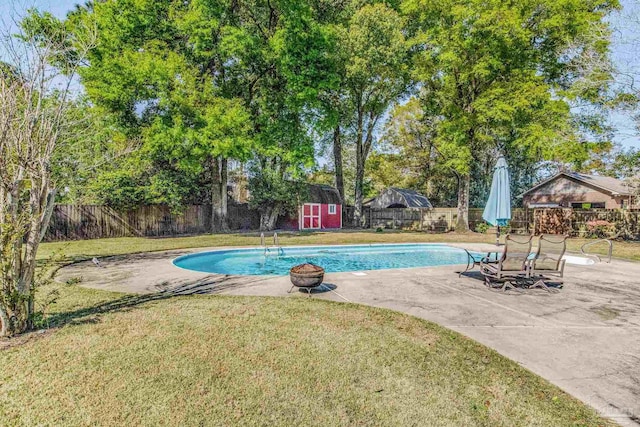 view of pool with a gazebo, a patio area, a yard, and a storage unit