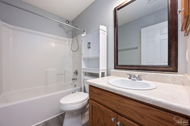 bathroom with shower / bathtub combination, vanity, and toilet