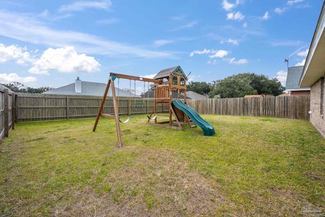 view of jungle gym with a fenced backyard and a lawn