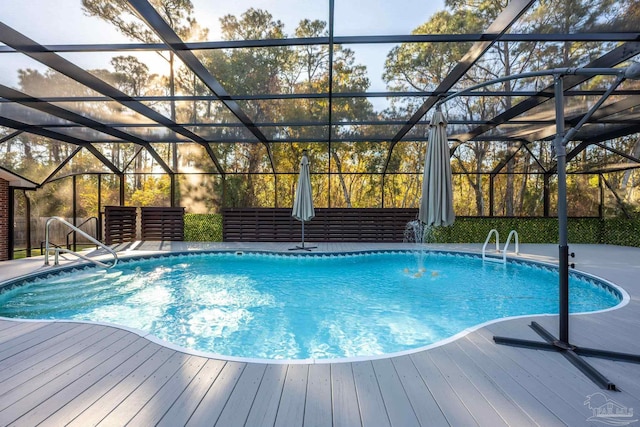 view of pool featuring pool water feature and a lanai