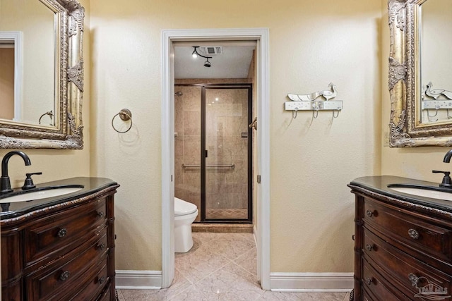 bathroom with vanity, toilet, and walk in shower