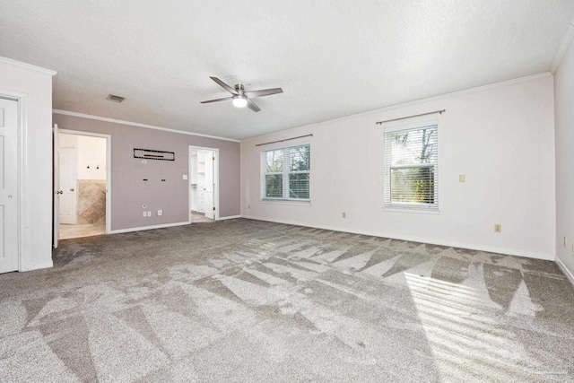 interior space with a textured ceiling, ceiling fan, and crown molding