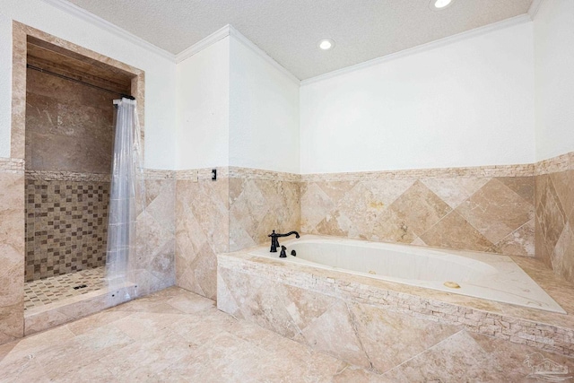 bathroom featuring a textured ceiling, shower with separate bathtub, crown molding, and tile walls