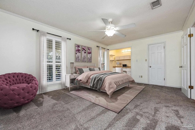 carpeted bedroom featuring ceiling fan, a textured ceiling, and ornamental molding