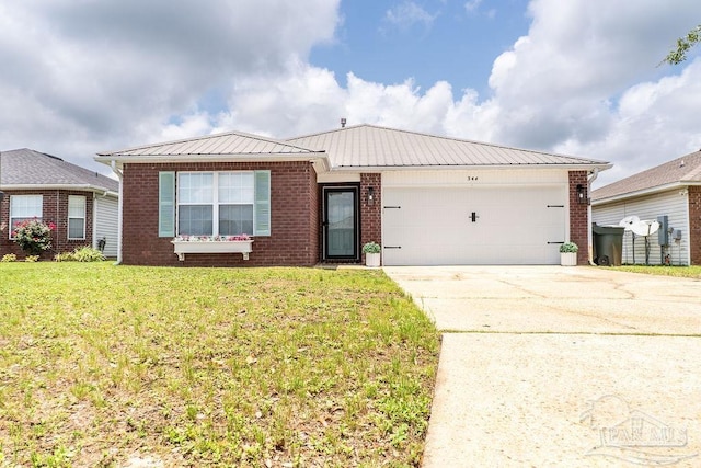 view of front of home featuring a garage and a front yard