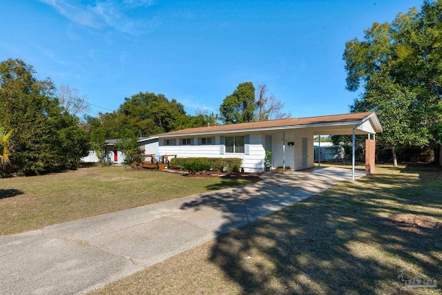 ranch-style house featuring a front lawn and a carport