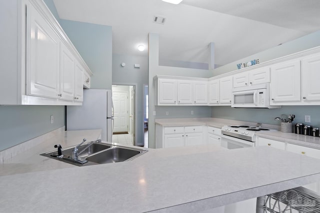 10738 Magnolia Ln, Lillian, AL 36549 - kitchen with visible vents, a sink, white appliances, white cabinets, and light countertops