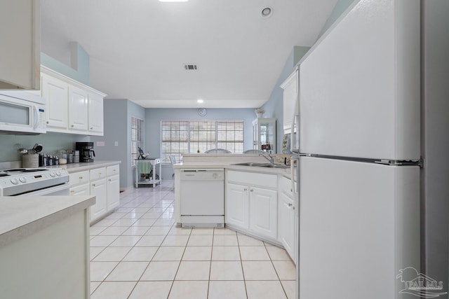 10738 Magnolia Ln, Lillian, AL 36549 - kitchen with visible vents, a sink, white cabinetry, white appliances, and light tile patterned flooring