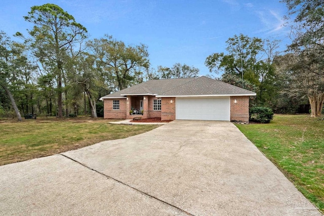 10738 Magnolia Ln, Lillian, AL 36549 - ranch-style home featuring a garage, driveway, brick siding, and a front yard