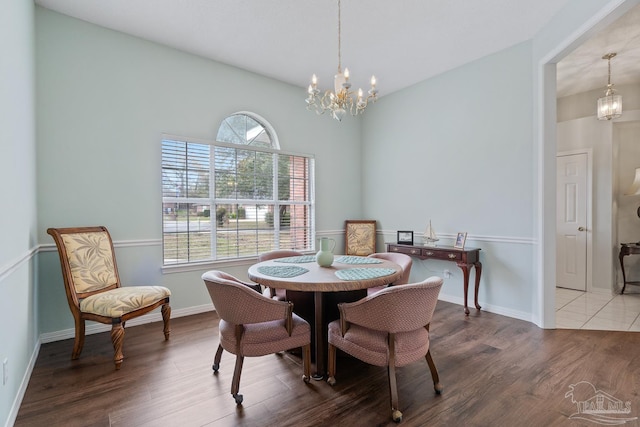 10738 Magnolia Ln, Lillian, AL 36549 - dining room featuring a chandelier, baseboards, and wood finished floors