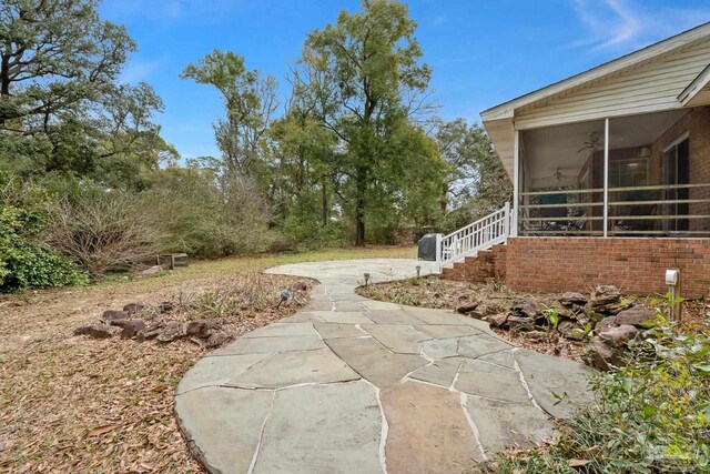 10738 Magnolia Ln, Lillian, AL 36549 - view of yard featuring a sunroom and ceiling fan