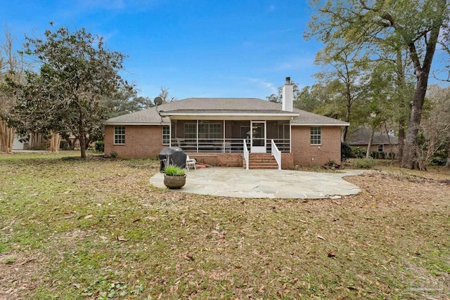 10738 Magnolia Ln, Lillian, AL 36549 - back of house featuring a patio, brick siding, a chimney, and a sunroom